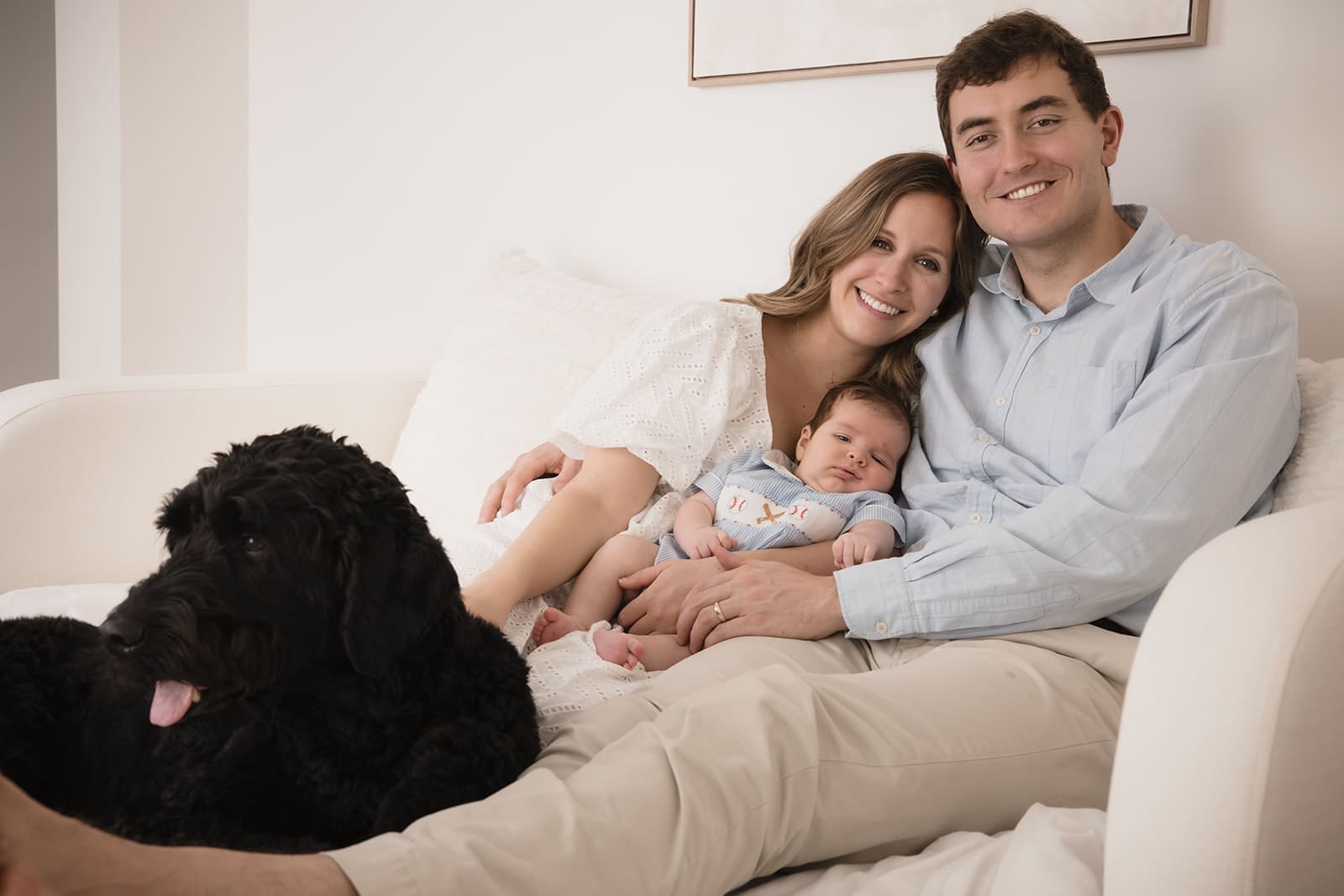 Calm studio family portrait with neutral outfits 
